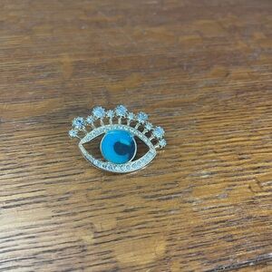 New silver tone evil eye crystal brooch, unique